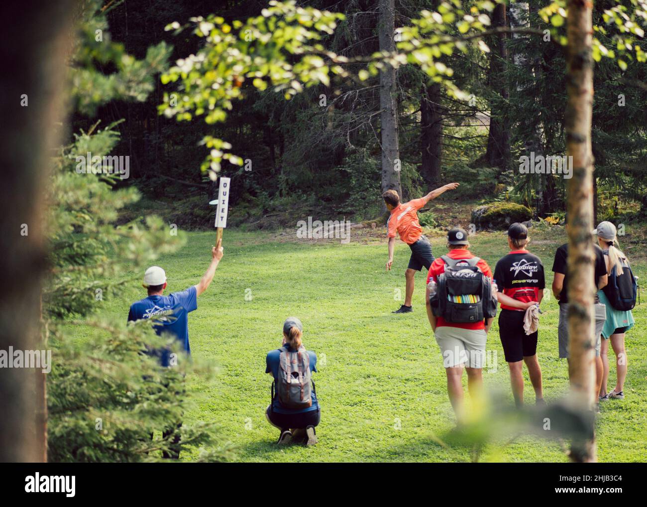 Group of people watching the Disc golf championships in Sipoo, Finland