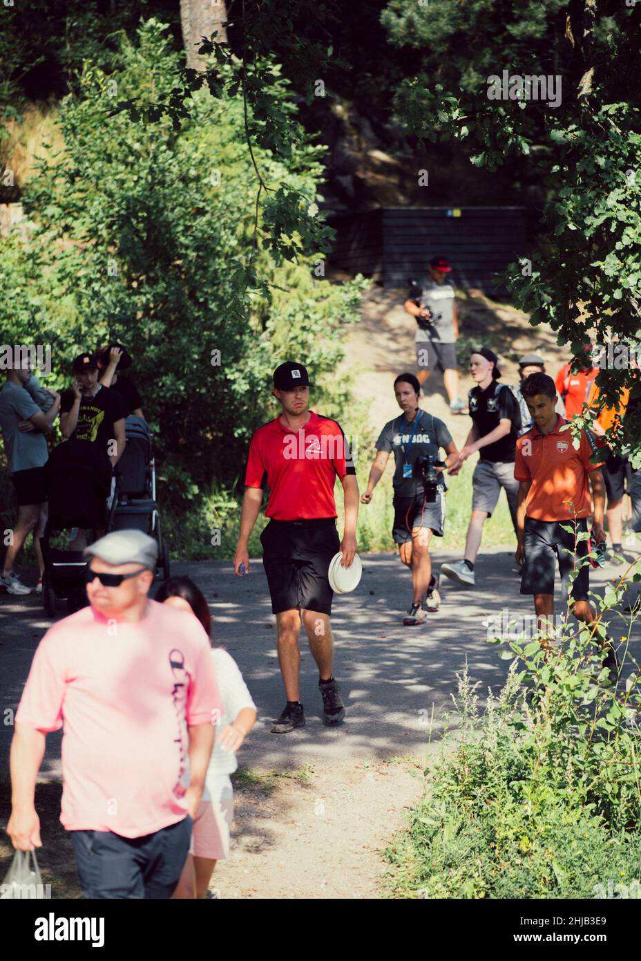 Group of people watching the Disc golf championships in Sipoo, Finland