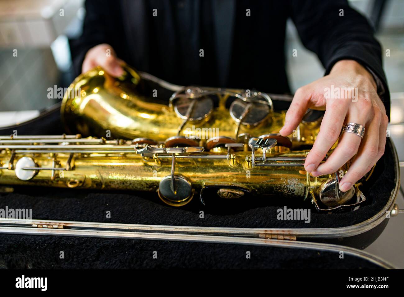 student learning to play on saxophone in the room Stock Photo Alamy