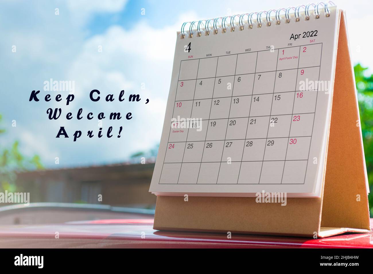 White April 2022 calendar on sky and clouds background with