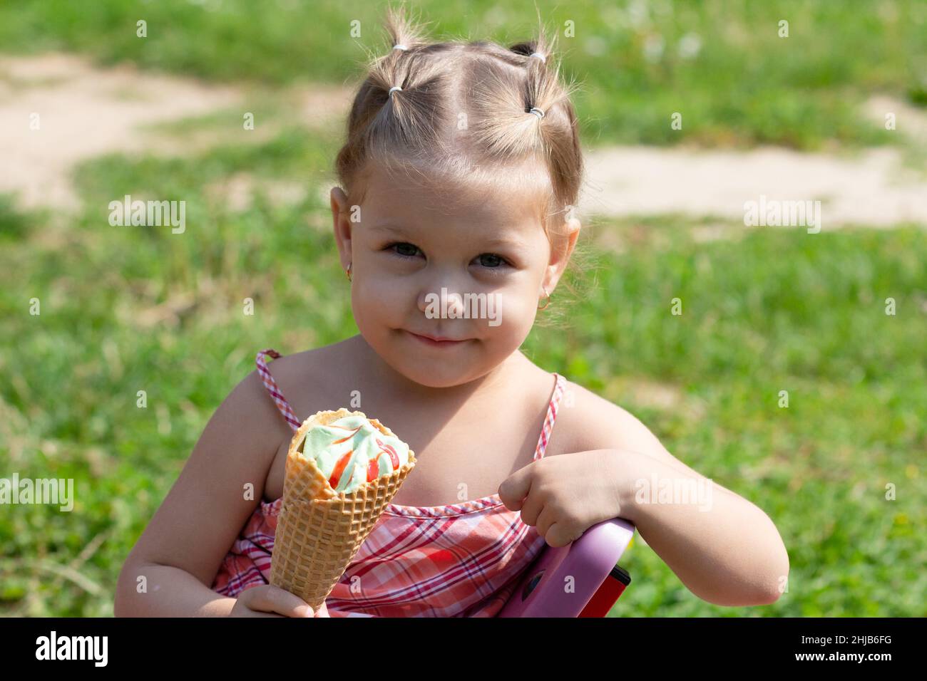 Happy little girl in the summer park Stock Photo - Alamy