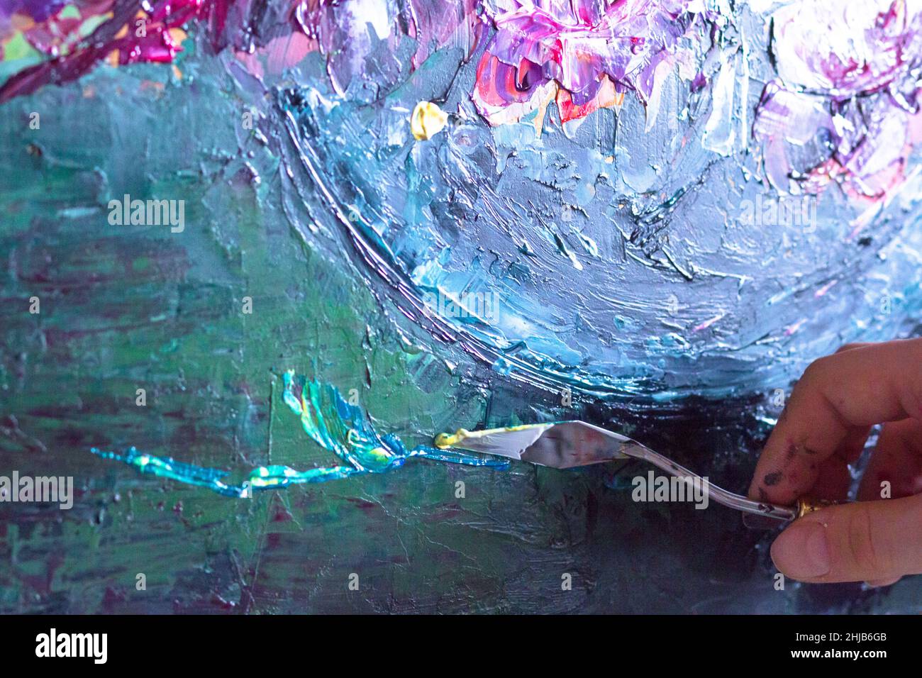 Woman hands painting with palette knife flowers by oil paints Stock ...