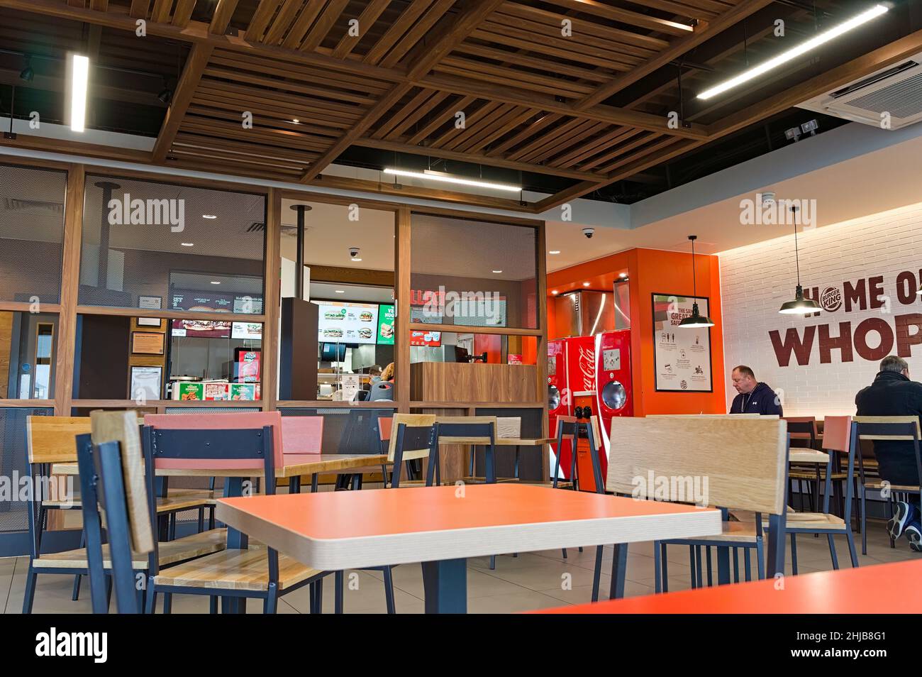 Burger King interior with orange, brown & beige decoration..The fast food outlet at the new quadrant development in Wyberton. Stock Photo