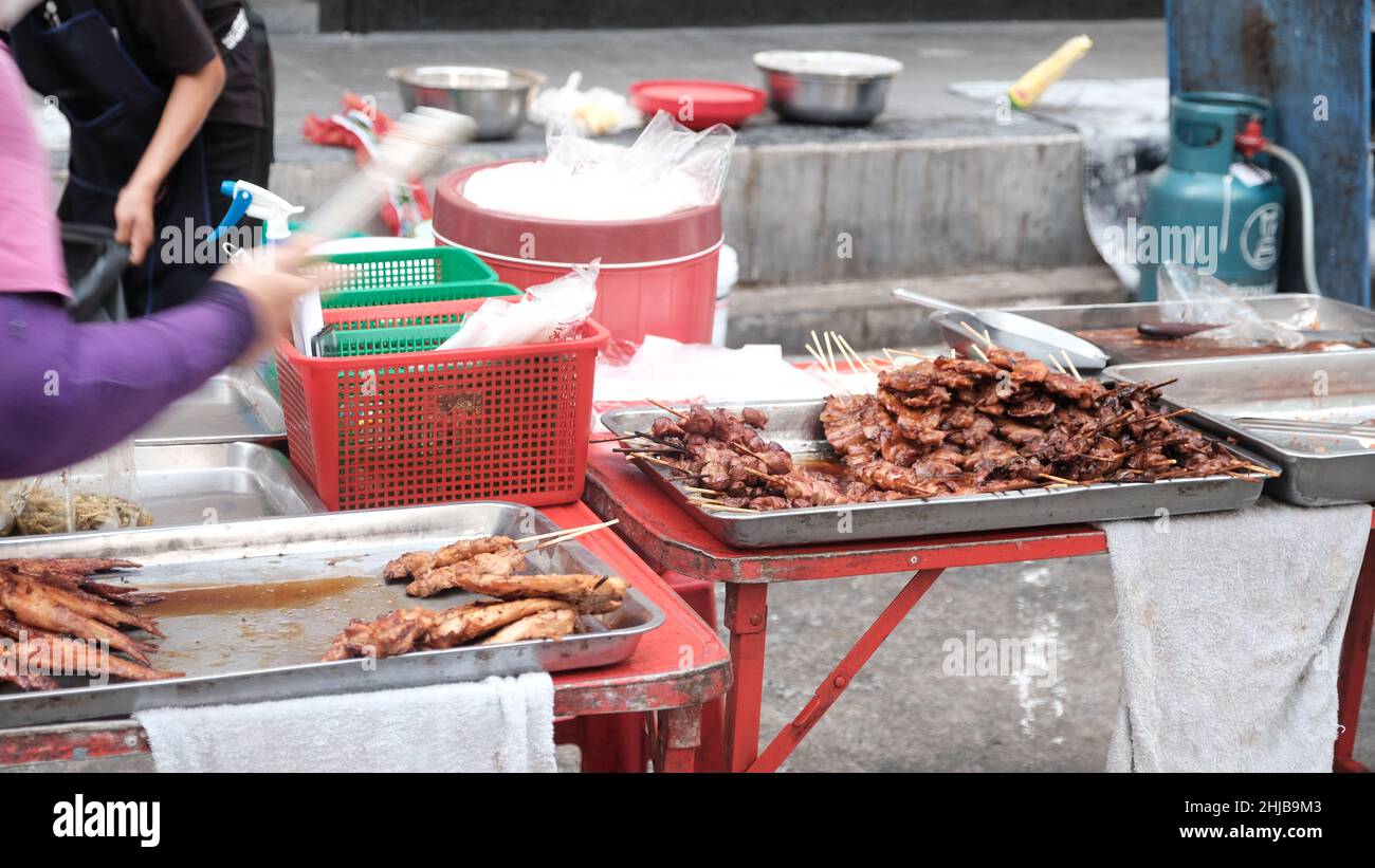 Low Income Economy Food Hawkers on Sukhumvit Road Bangkok Thailand Stock Photo