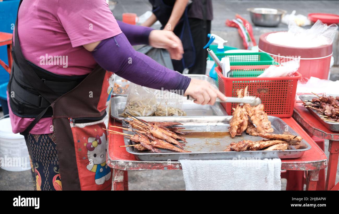 Low Income Economy Food Hawkers on Sukhumvit Road Bangkok Thailand Stock Photo