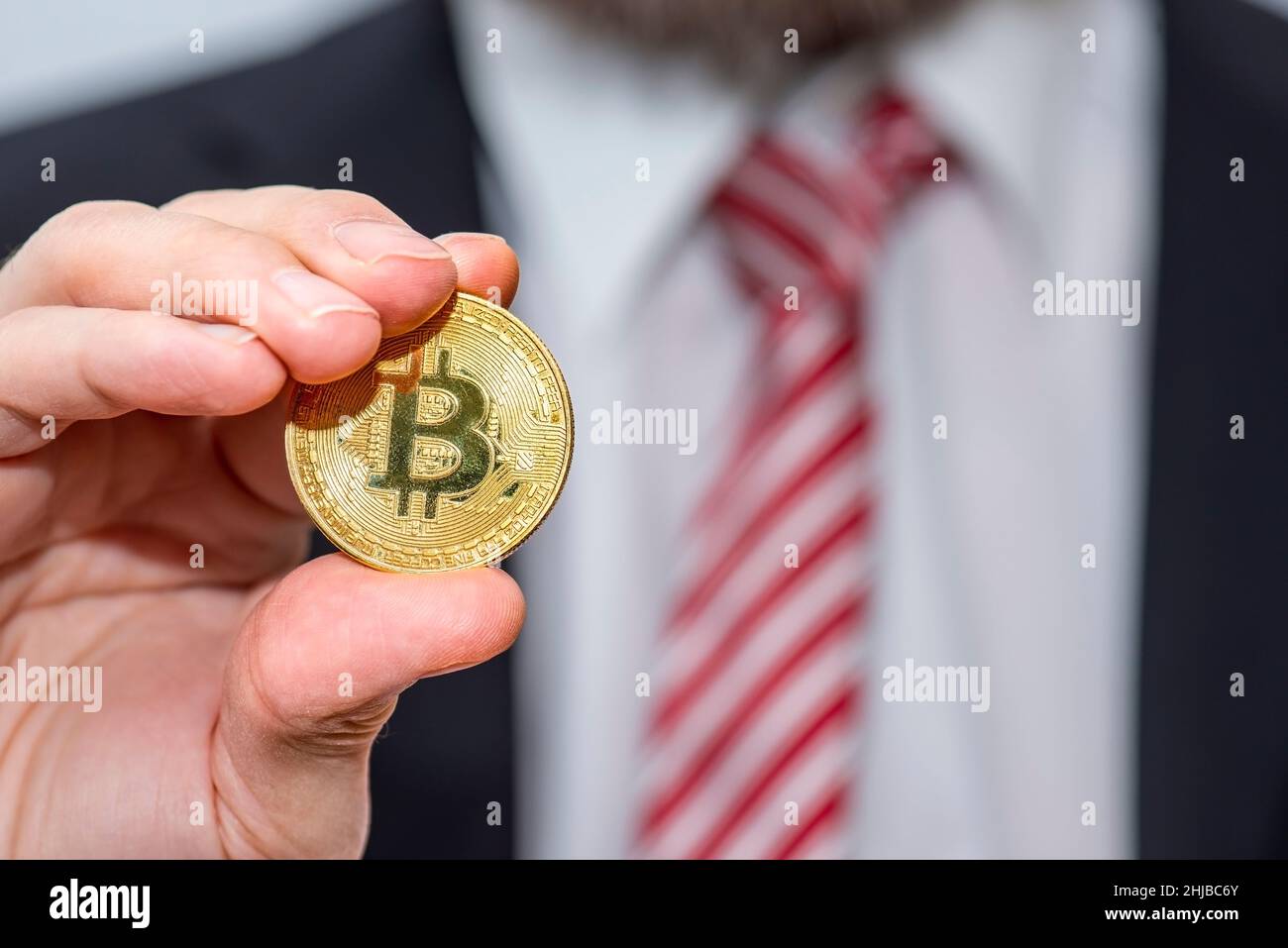 devaluation bitcoin. Close up bitcoin and digital stock market graph bar on black. Cryptocurrency. Bitcoin Stock Growth. Investing in virtual assets. Stock Photo