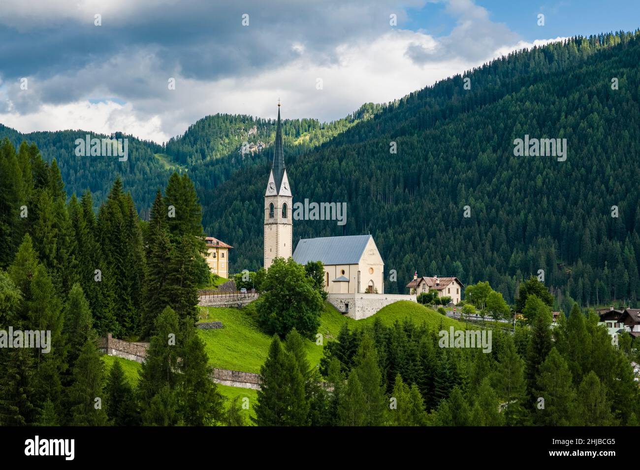 The church Chiesa di San Lorenzo Martire in Selva di Cadore at the foot of Giau Pass, Passo di Giau. Stock Photo