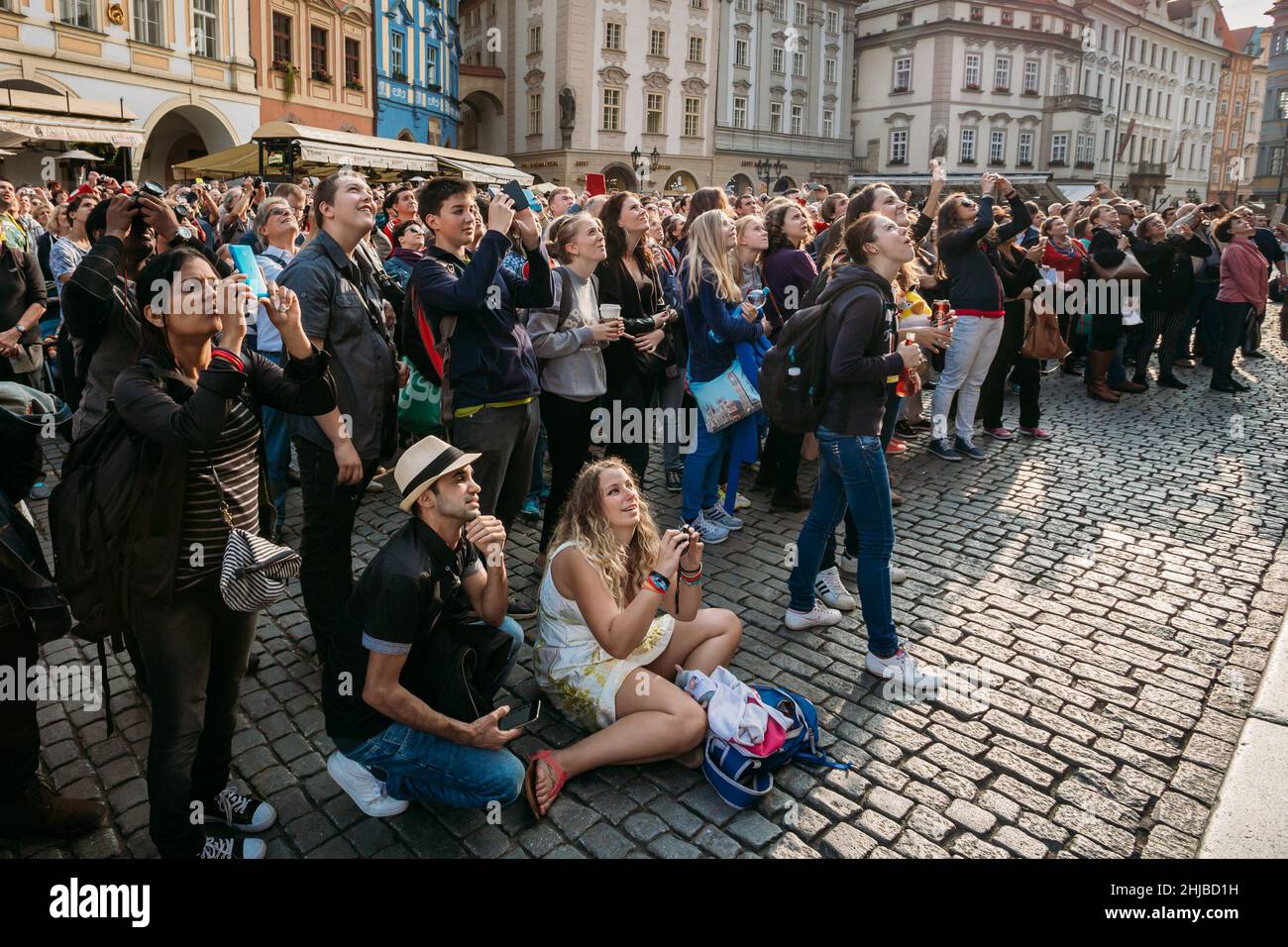 Group of tourists taking photo of town hall with astronomical clock - Orloj in Prague, Czech Republic Stock Photo