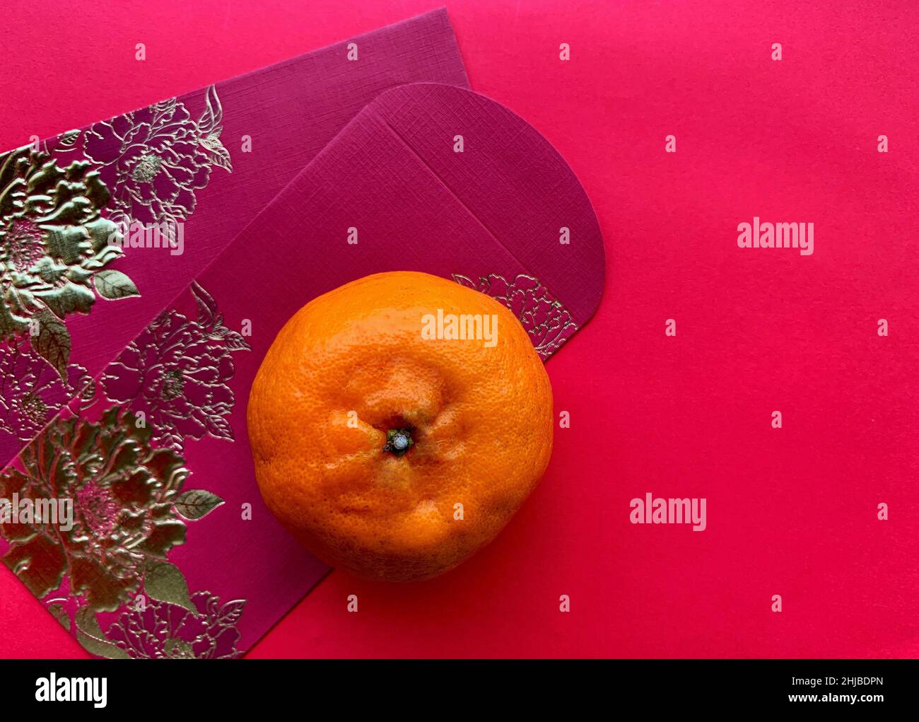Happy Chinese New Year Celebration concept. With yellow envelope and mandarin orange Stock Photo