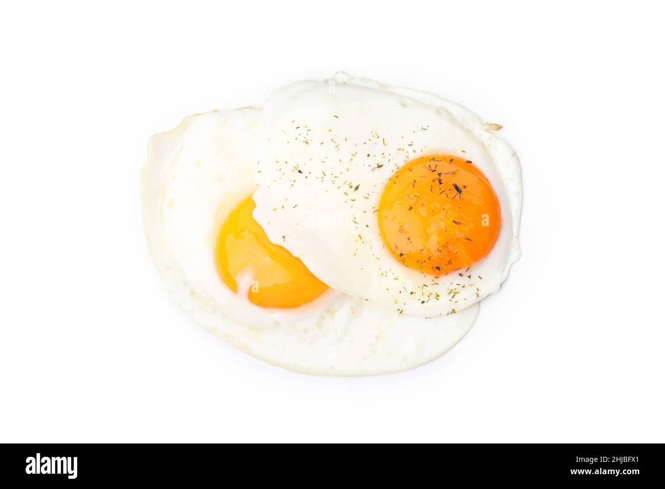 Fried eggs with spices isolated on white background Stock Photo - Alamy