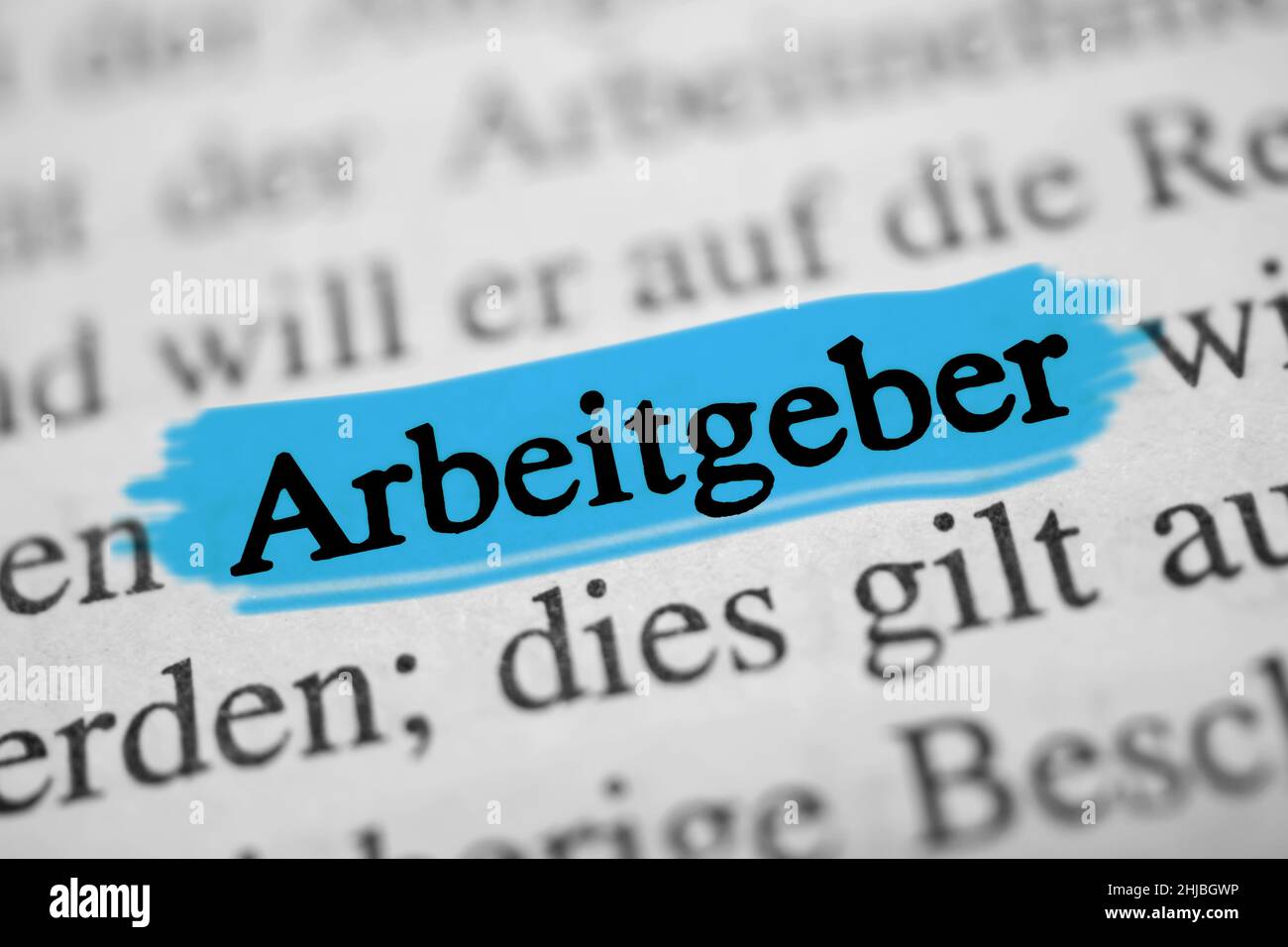 Closeup on the highlighted German word 'Arbeitgeber' in a newspaper. Translation: employer Stock Photo