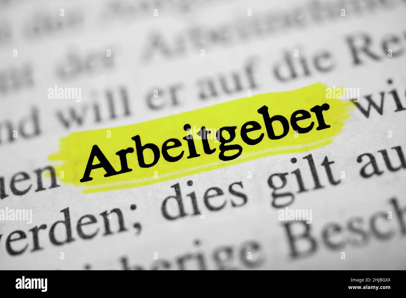 Closeup on the highlighted German word 'Arbeitgeber' in a newspaper. Translation: employer Stock Photo