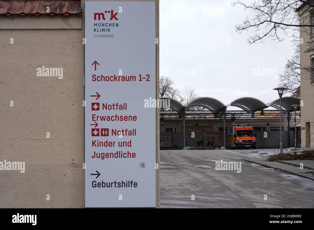 View of the entrance to the emergency room of München Klinik Schwabing (formerly Klinikum Schwabing). An ambulance is parked in the courtyard. Stock Photo