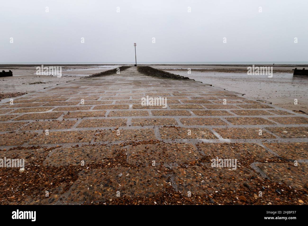 a brick water outlet looking out to sea in Worthing, West Sussex,UK, January 2022 Stock Photo