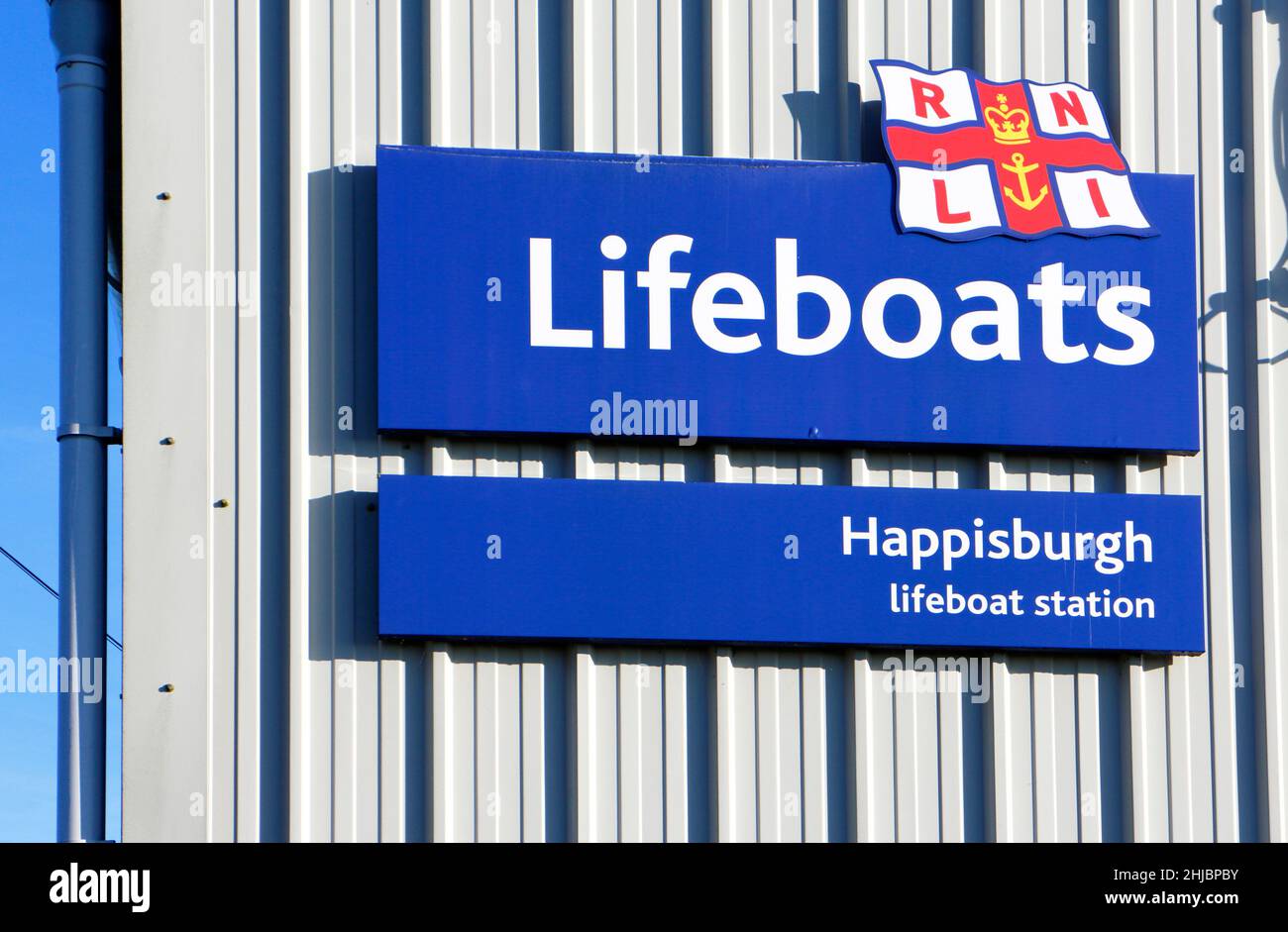 RNLI Lifeboats sign at the inshore Lifeboat Station on the North Norfolk coast at Cart Gap, Happisburgh, Norfolk, England, United Kingdom. Stock Photo