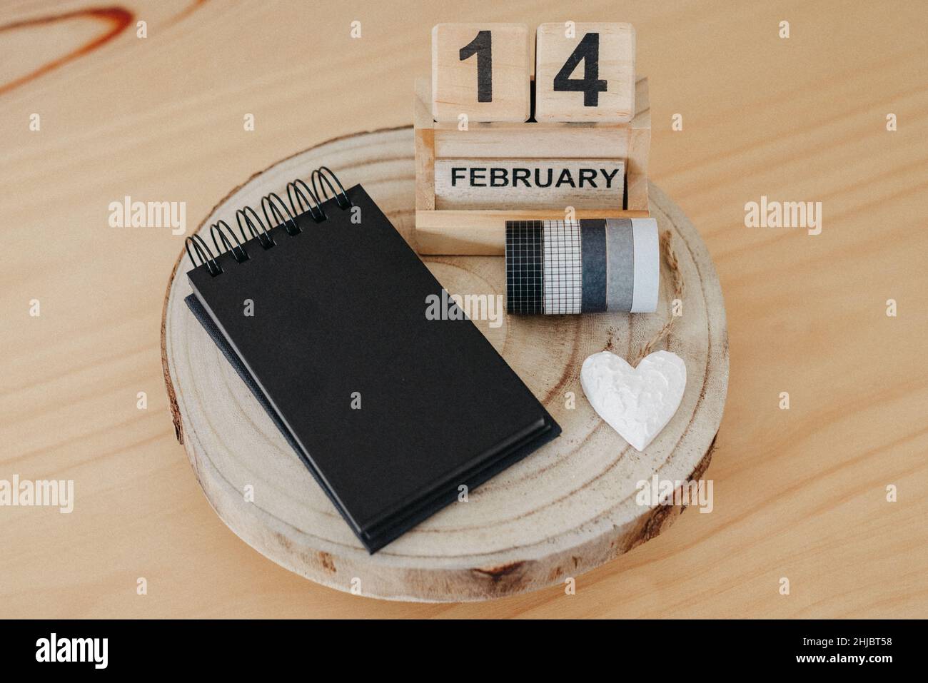 Wooden calendar on February 14 with a heart. Happy Valentines Day concept Stock Photo