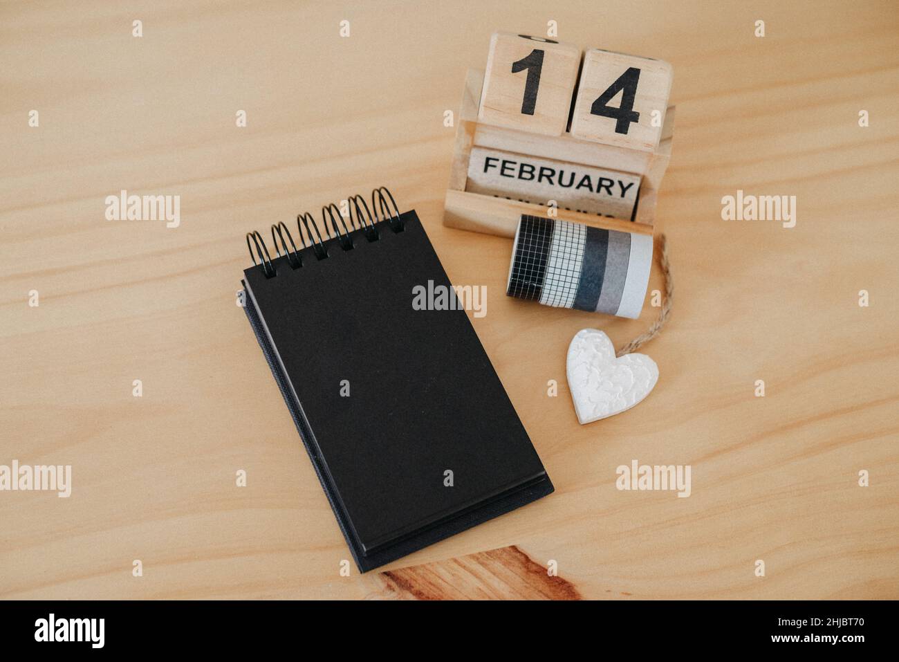 Wooden calendar on February 14 with a heart. Happy Valentines Day concept Stock Photo