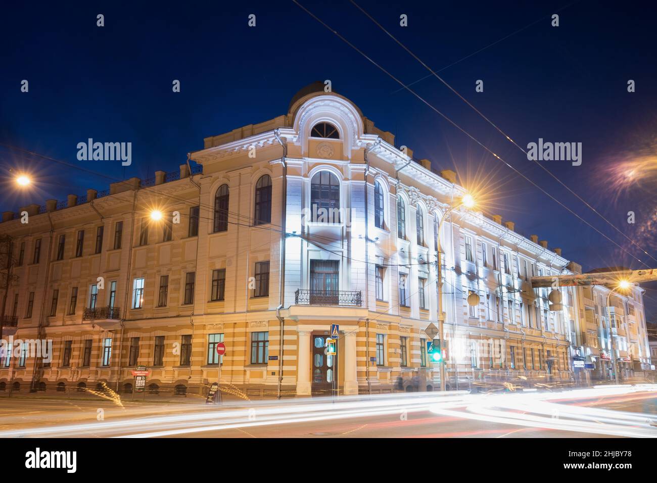Gomel, Belarus. Old Building At Intersection Of Sovetskaya And Irininskaya Streets In Night Illuminations Lights Stock Photo