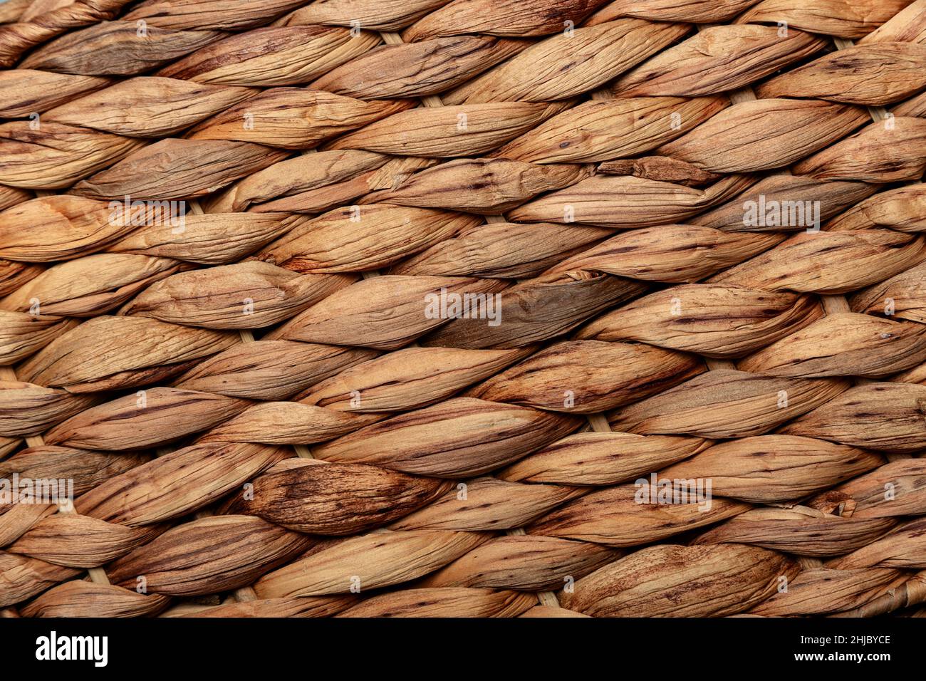 Texture of a wicker surface from banana palm branches. Stock Photo