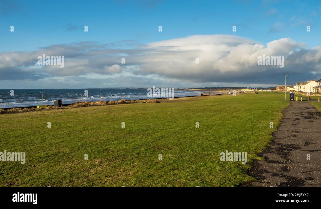 Grassy area on the sea front at Prestwick in January winter sunshine Stock Photo