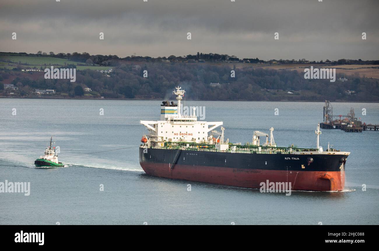 Whitegate, Cork, Ireland. 28th January, 2022. Tug boat Alex escorts  tanker Alfa Italia out of the harbour after discharing her cargo of crude oil at the  refinery in Whitegate, Co. Cork, Ireland. - Credit; David Creedon / Alamy Live News Stock Photo