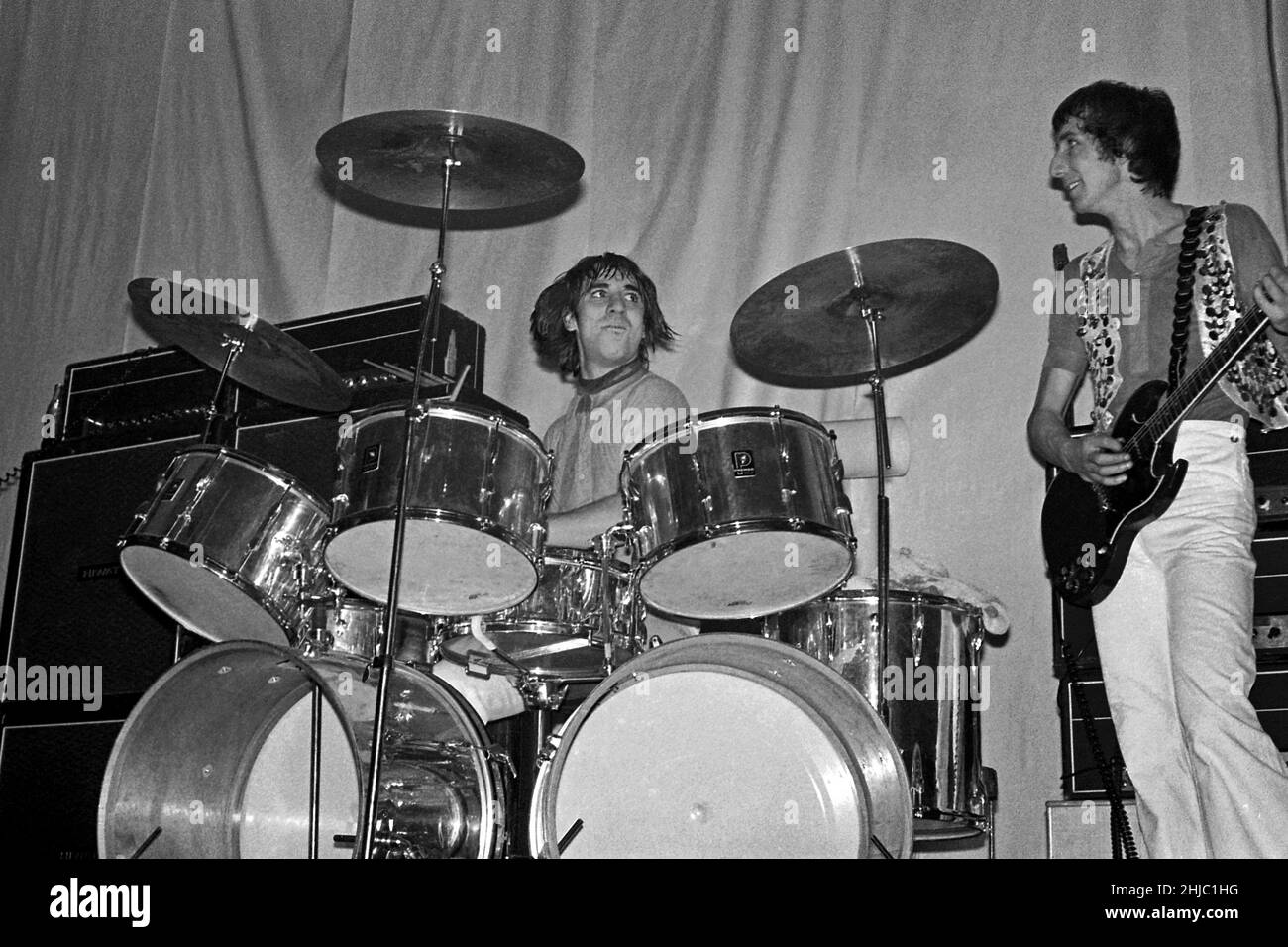 Keith Moon (drummer) keeps his eye on Pete Townsend while performing with The Who in the Anson Rooms, Bristol University Students’ Union, 7 December 1968 Stock Photo