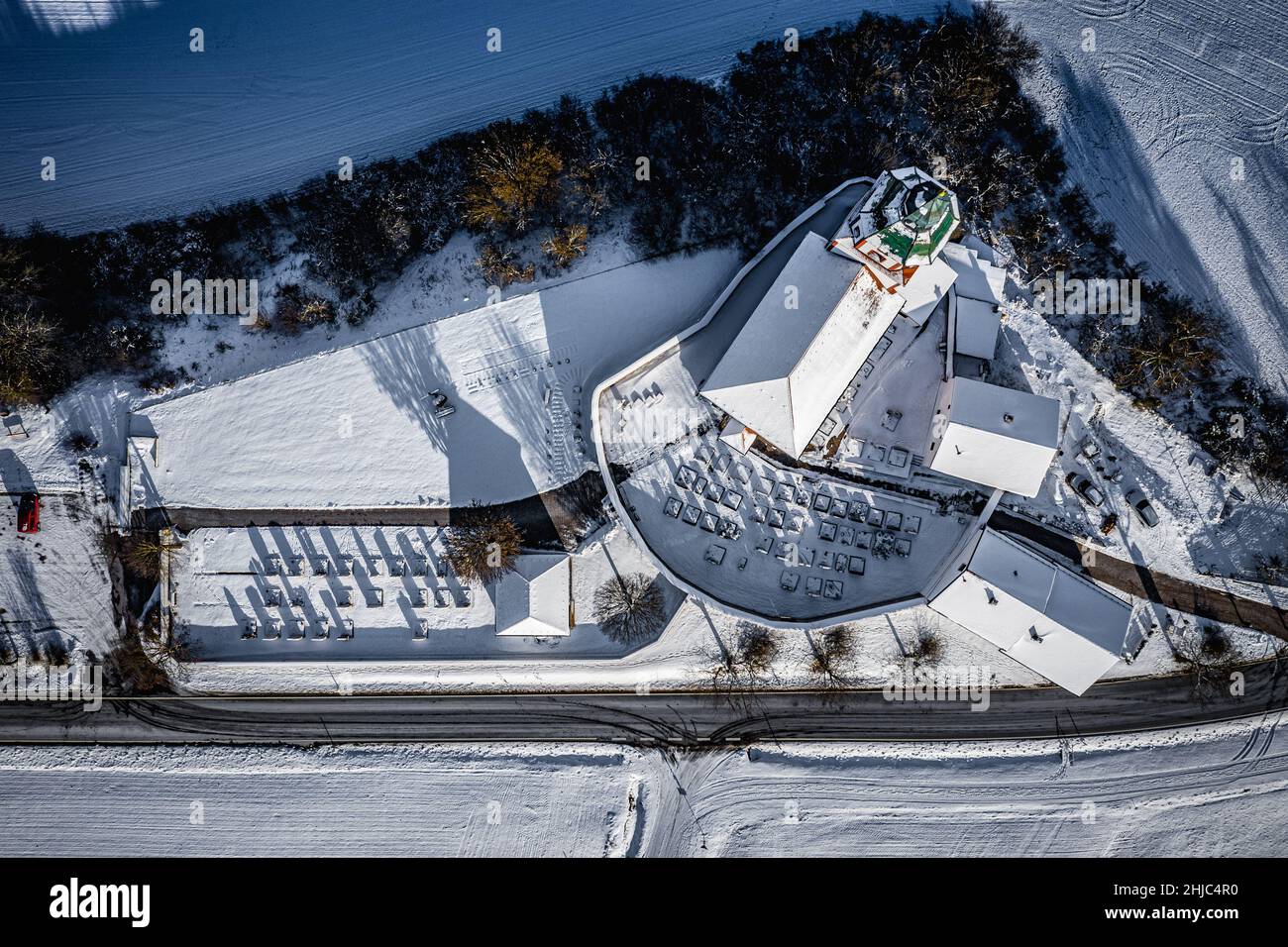 aerial view of a church with cemetry in nature park altmühltal, bavaria, germany on a sunny day in winter Stock Photo