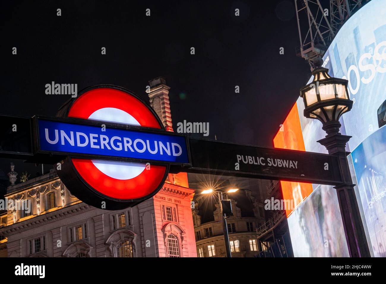 Famous London public underground subway sign with street lamps Stock Photo