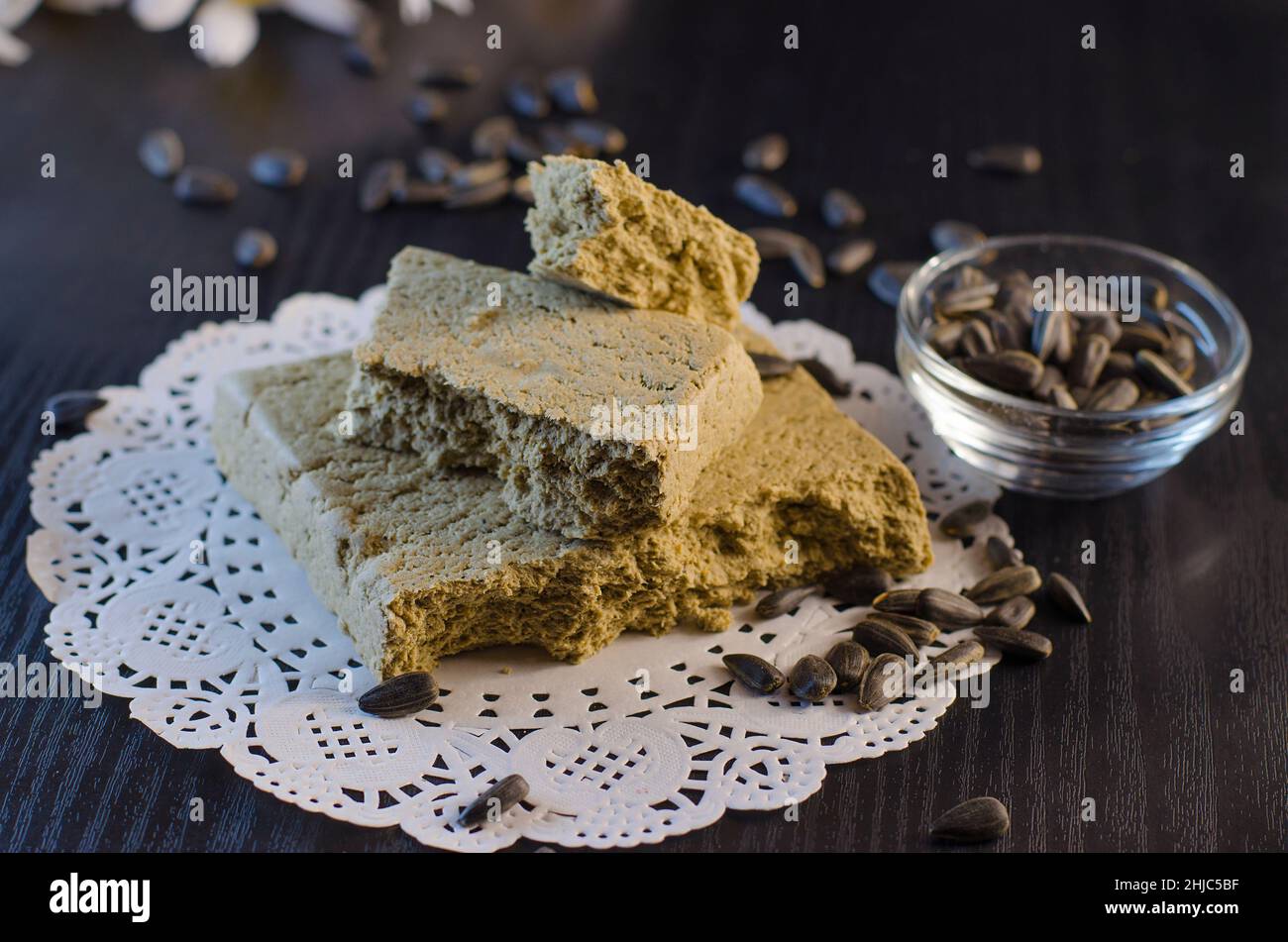 halva and sunflower seeds closeup on a black background Stock Photo