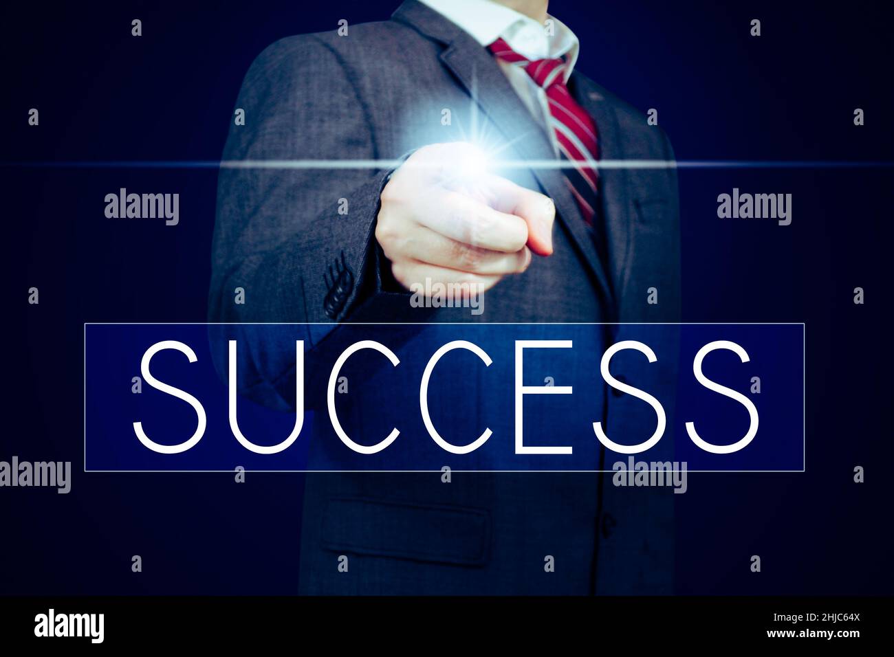 Success - lettering, businessman pointing finger Stock Photo