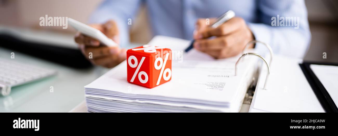 Calculating VAT Tax Percentage And Invoice Discount Stock Photo