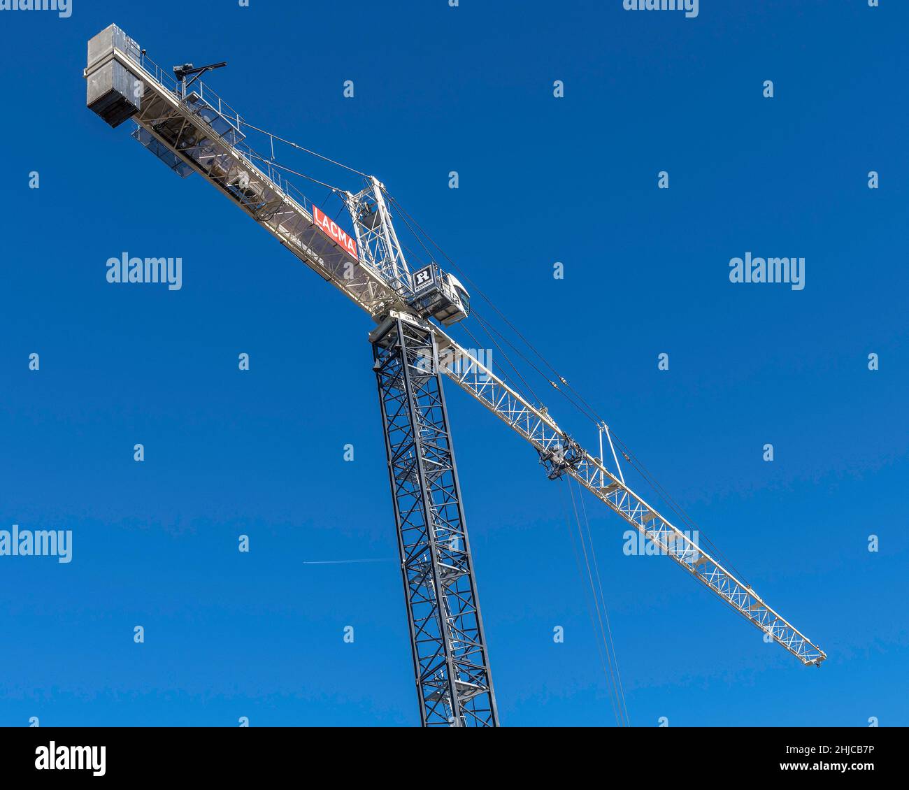 Los Angeles, CA, USA - January 26, 2022: Tower cranes soar ab…