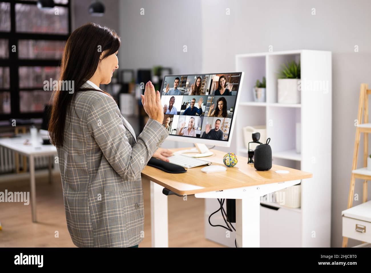 Videoconference Desk Video Conference Call Using Electric Adjustable Height Standing Desk ...