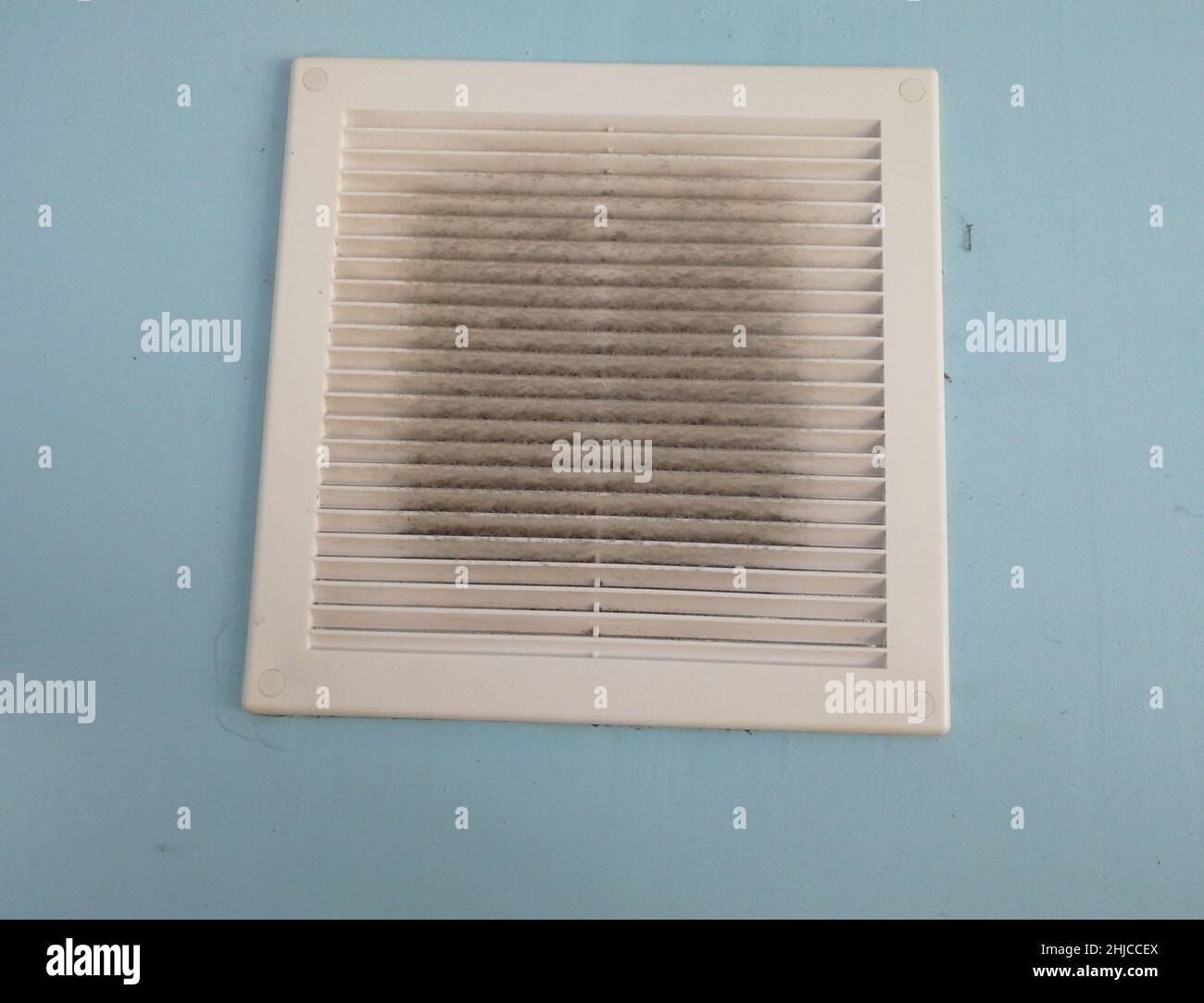 Dirty air ventilation grill hatch. dusty clogged filter. Background