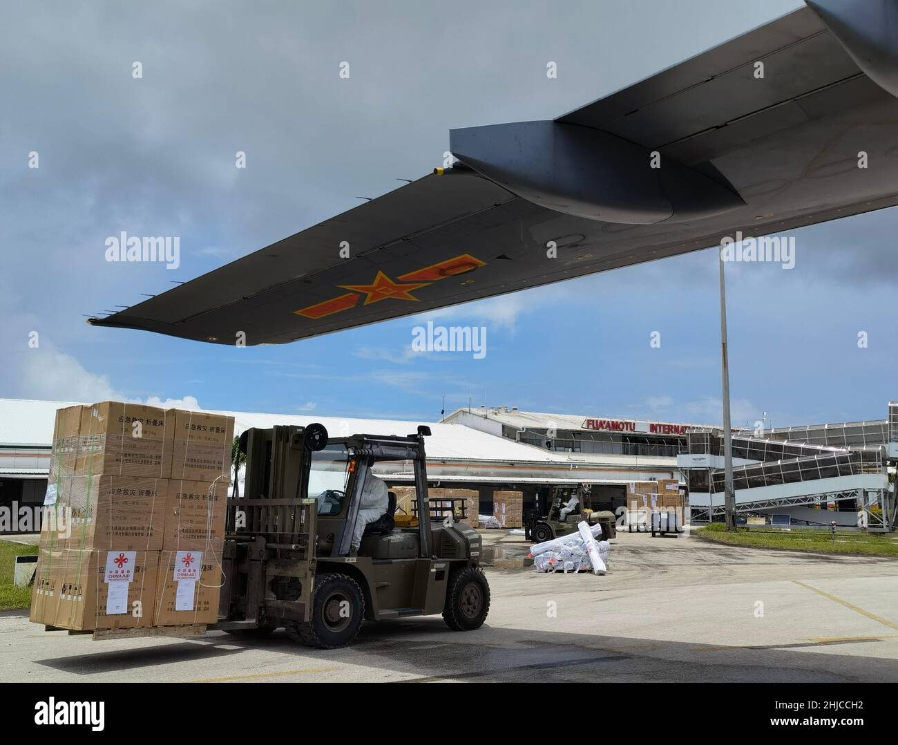 Nuku'alofa, Tonga. 28th Jan, 2022. Photo taken with a mobile phone shows staff members unloading