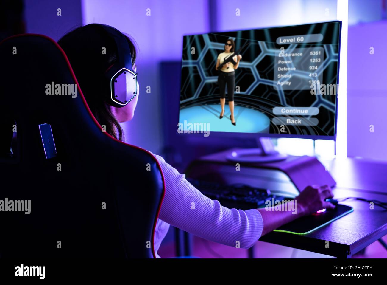 Online Esports PC Player. Young Gamer Girl Stock Photo
