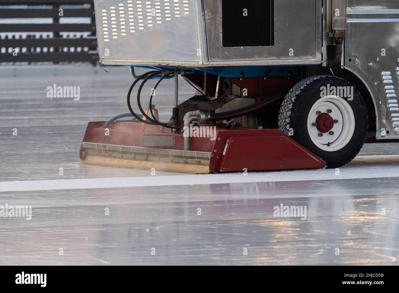Polished ice maintenance machine ice preparation at rink between