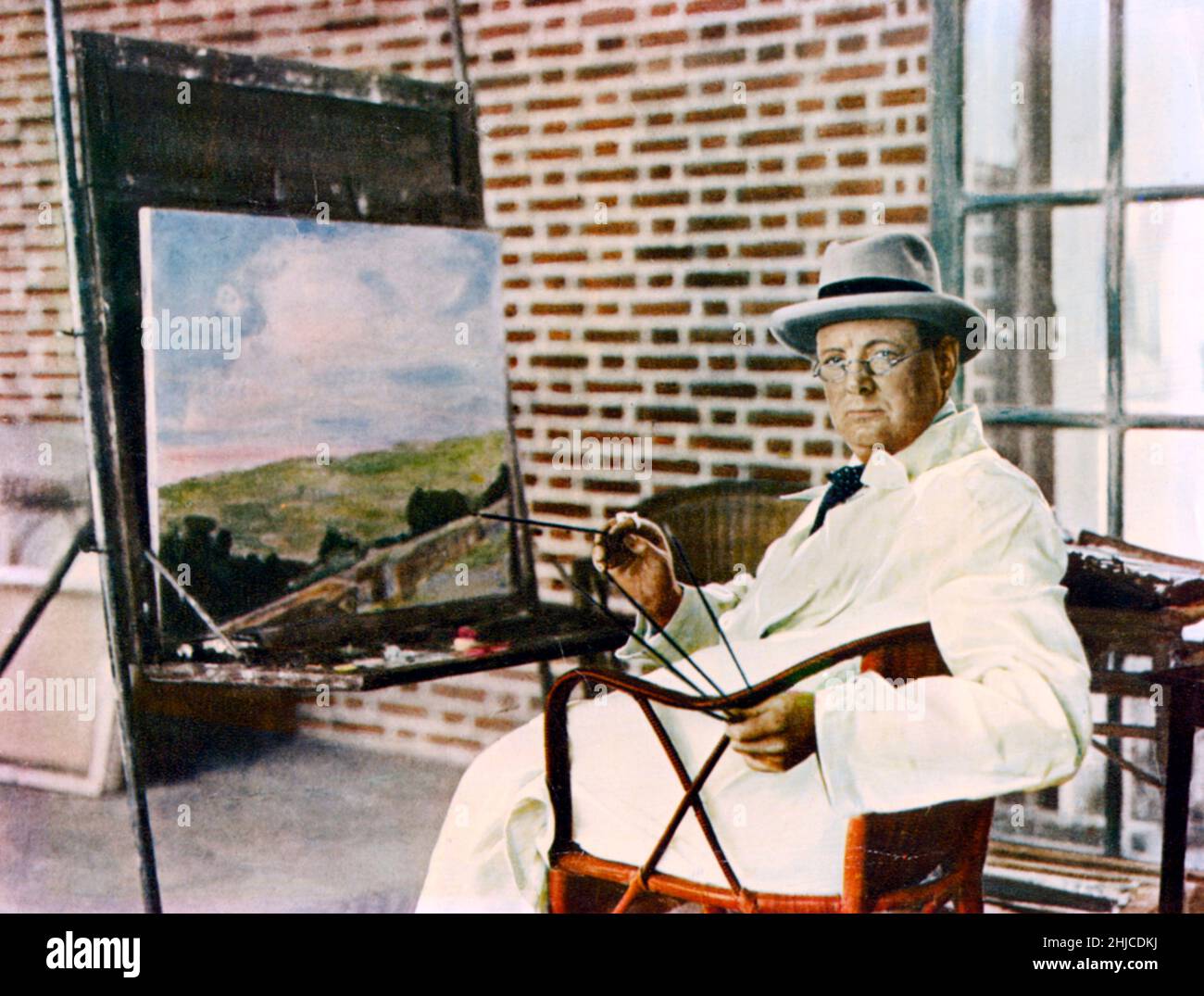 Winston Churchill. British statesman who served as Prime minister of the United Kingdom from 1940 to 1945 during the Second world war. Born on november 30 1874, dead january 24 1965. Pictured while painting in the 1940s Stock Photo