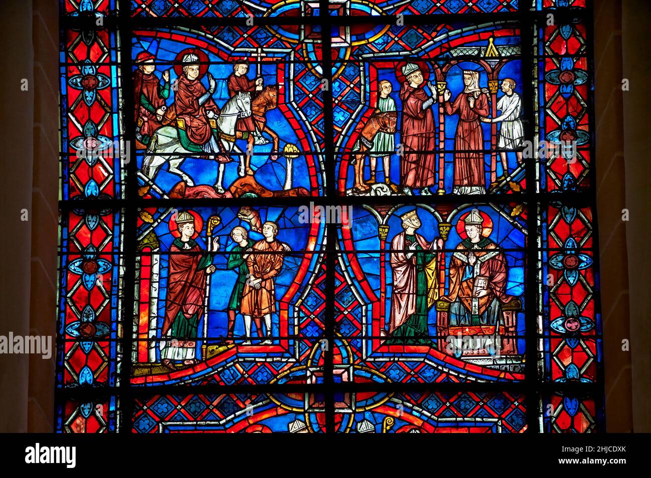 Medieval stained glass Window of the Gothic Cathedral of Chartres, France - dedicated to the Life of St Remigius (Remy).    Remigius (c. 437 – January Stock Photo
