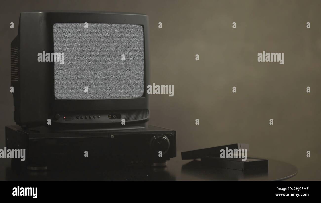 TV with noise. TV test card. Retro hardware 1980. Glitch art show static error, broken transmission. Noise tv screen pixels interfering signal. Stock Photo