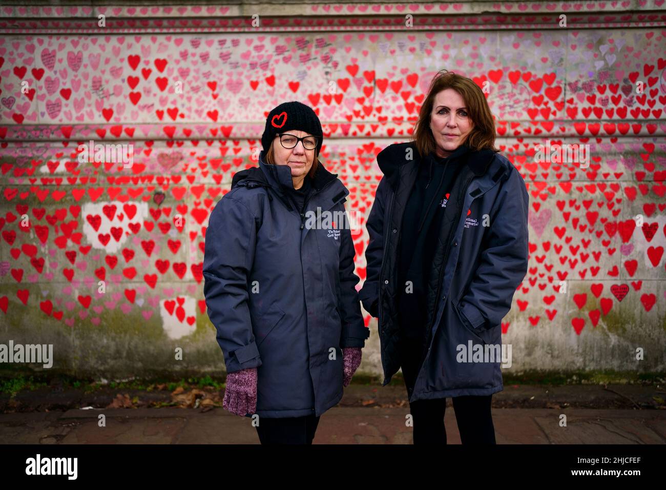 Lynn Jones (left) and Fran Hall from the Covid-19 Bereaved Families For Justice campaign group, standing by the National Covid Memorial Wall in Westminster. Picture date: Friday January 28, 2022. Stock Photo