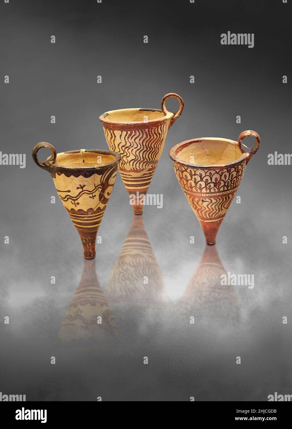 Mycenaean pottery - terracotta conical rhytha (rhython) with floral and wavy designs, Chamber tomb ET & B, 1500-1450 BC Nafplion Evangelistria.  Nafpl Stock Photo