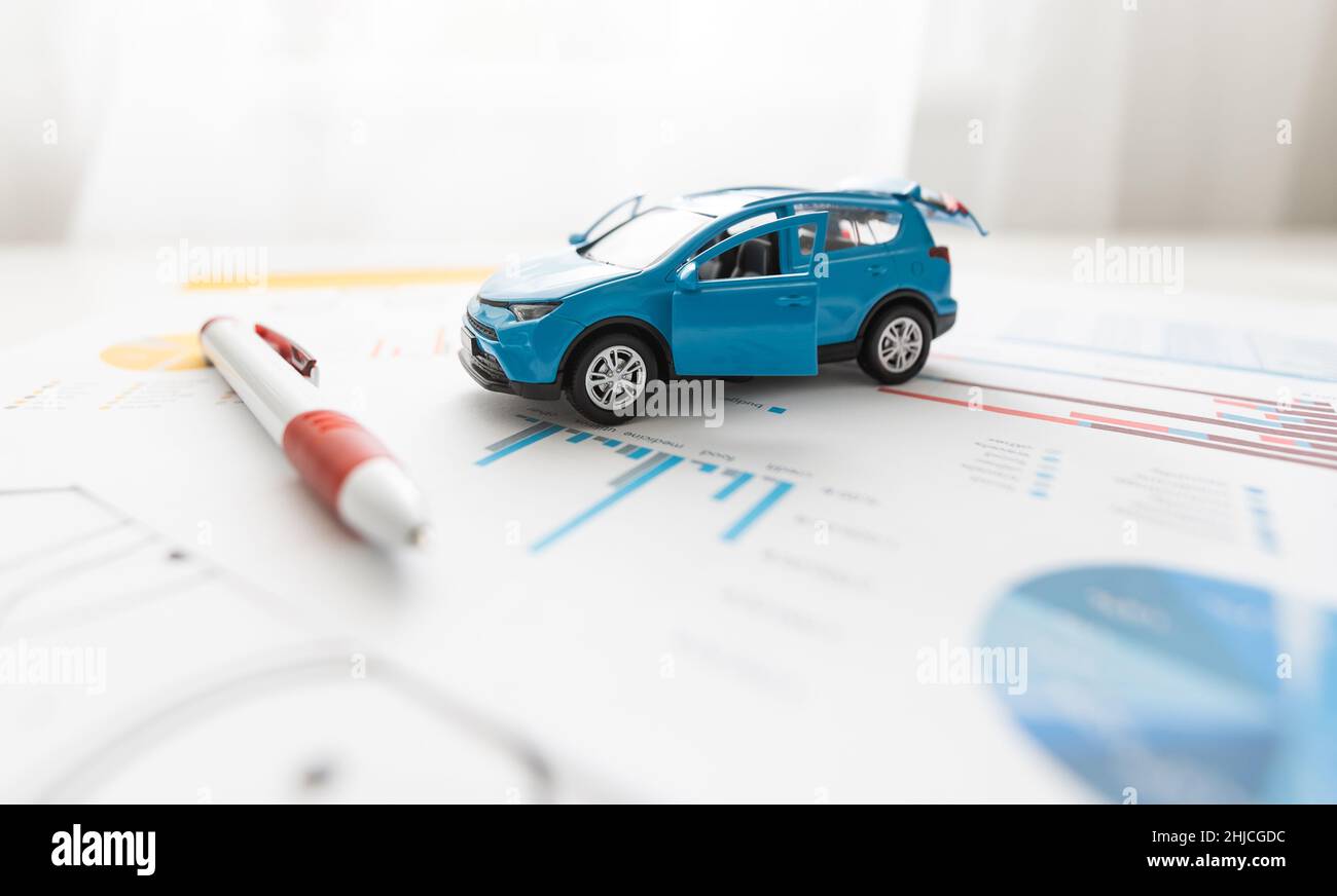 Front view of a blue toy car on sheets drawings Stock Photo - Alamy