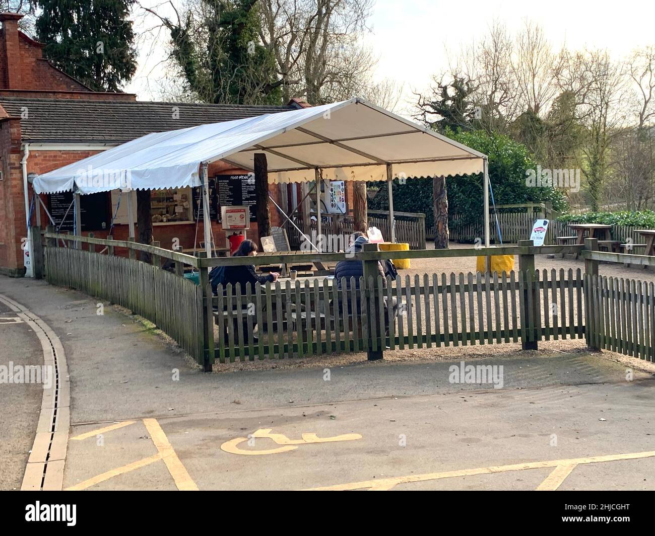Pump house cafe at Sywell Country Park Northamptonshire UK wood fence