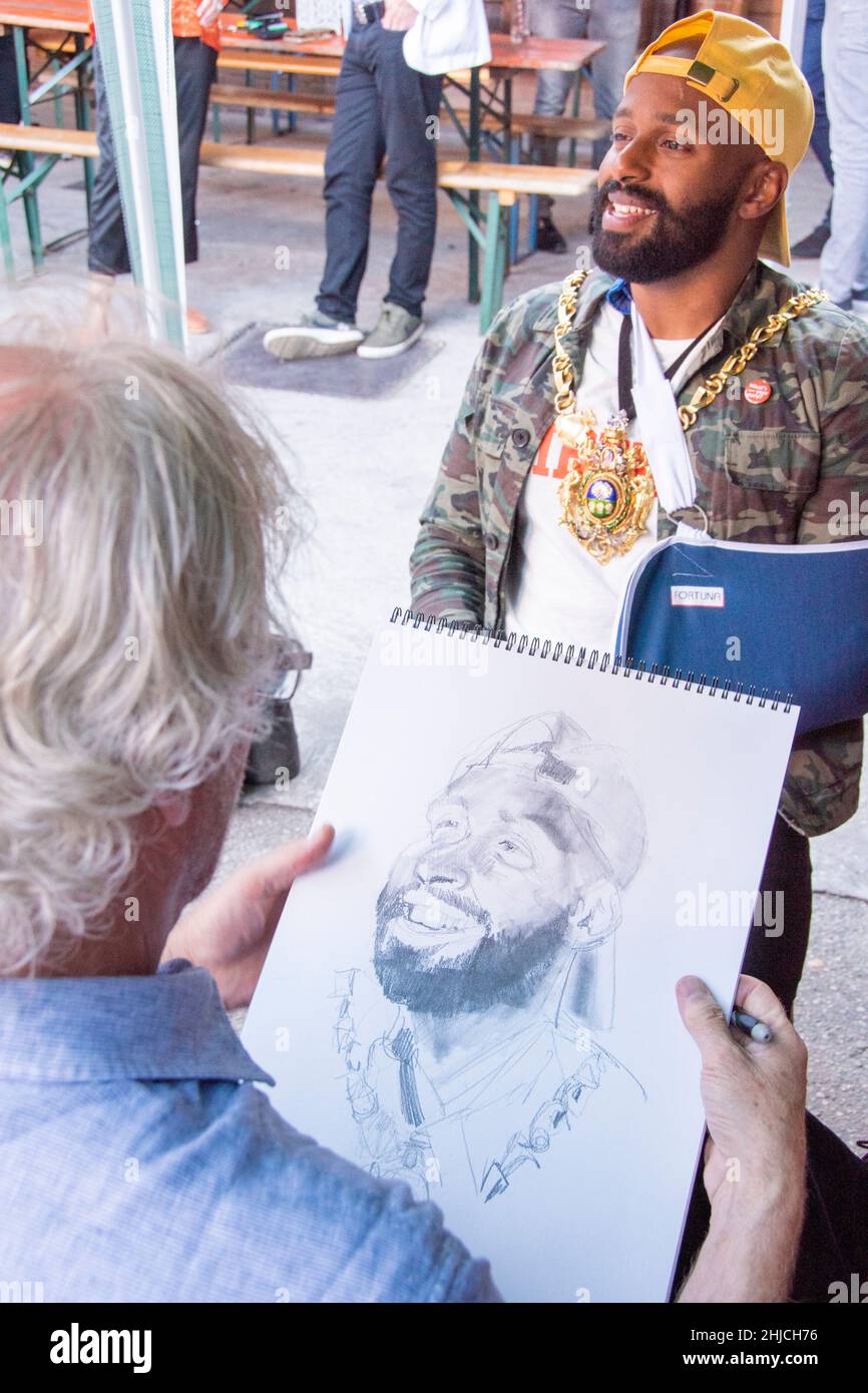 Sheffield, UK - June 22 Magic Majid Lord Mayor of Sheffield poses for a caricature by Brian Smith at the Sheffield Creative Guild 2nd Anniversary pa Stock Photo