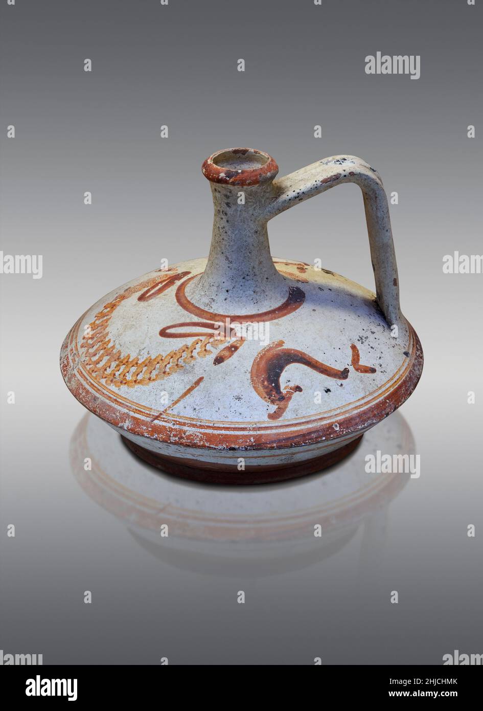 Ancient Greek white pottery lagynoi with brown painted patters. Epidaurus, 2-1st cent BC. Nafplion Archaeological Museum. Against grey background. Pho Stock Photo
