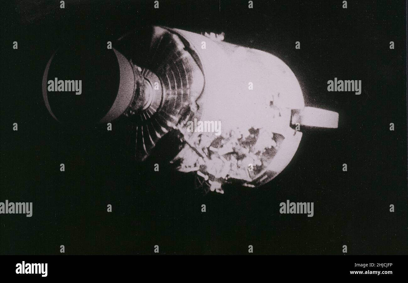 Damaged Apollo 13 Service Module. An entire SM panel was blown away by the apparent explosion of oxygen tank number two located The damaged area. The damage to the SM caused the Apollo 13 crewmen to use the Lunar Module (LM) as a 'lifeboat.' The Lunar Module 'Aquarius' was jettisoned just prior to Earth reentry by the Command Module 'Odyssey'. 04/17/1970 Stock Photo