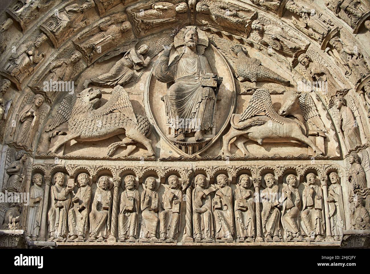 Chartres Cathedral gothic statues and exterior sculptures West Facade, Central Portal Tympanum, c. 1145.  The tympanum shows gothic sculptures of Jesu Stock Photo