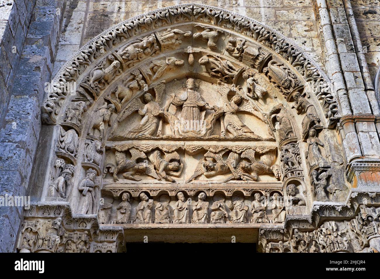 West Facade, Left Portal - General View of Tympanum c. 1145. Cathedral of Chartres, France . The tympanum of the left door shows the Ascension or the Stock Photo