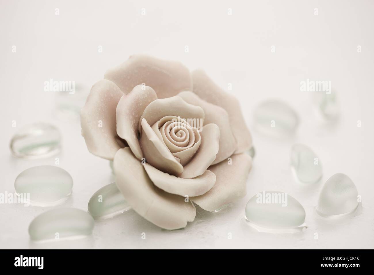Light Rose Ceramic Rose with Transparent Stones Stock Photo - Alamy